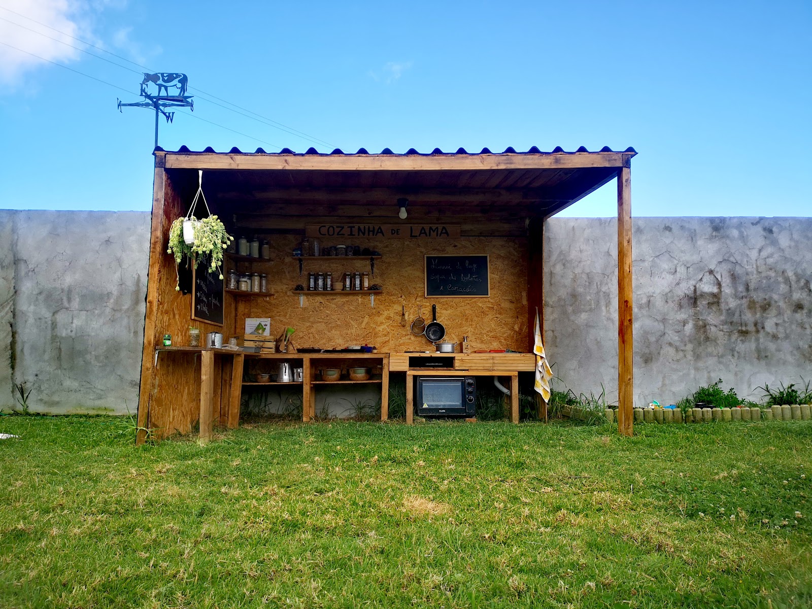 Garden with grass, trees, and raised wooden play structure